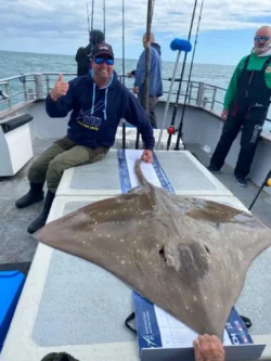 Sea Angler with specimen ray catch on a group fishing trip with Atlantic Whale and Wildlife Tours